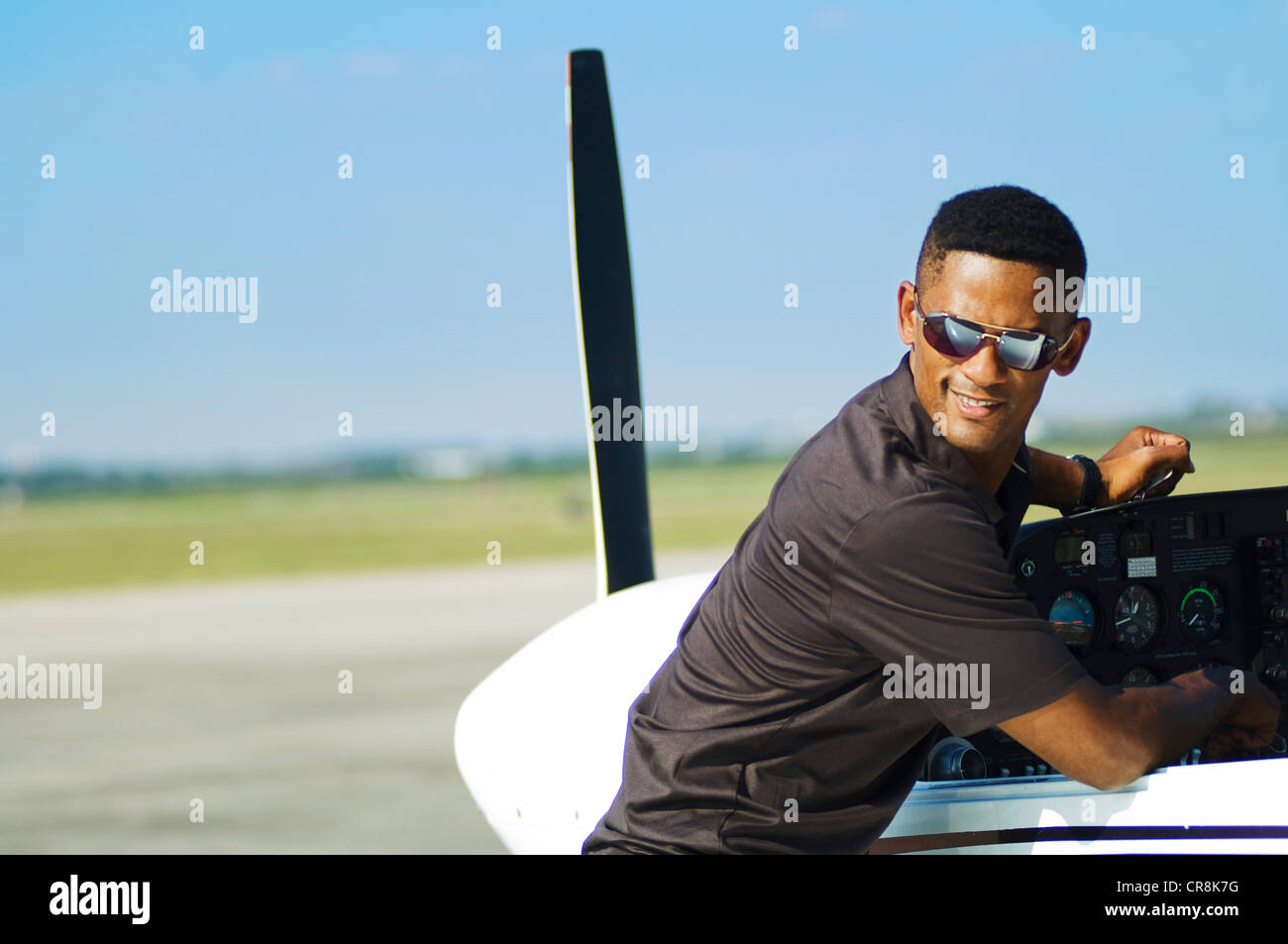 African american pilot checking hi-res stock photography and images - Alamy