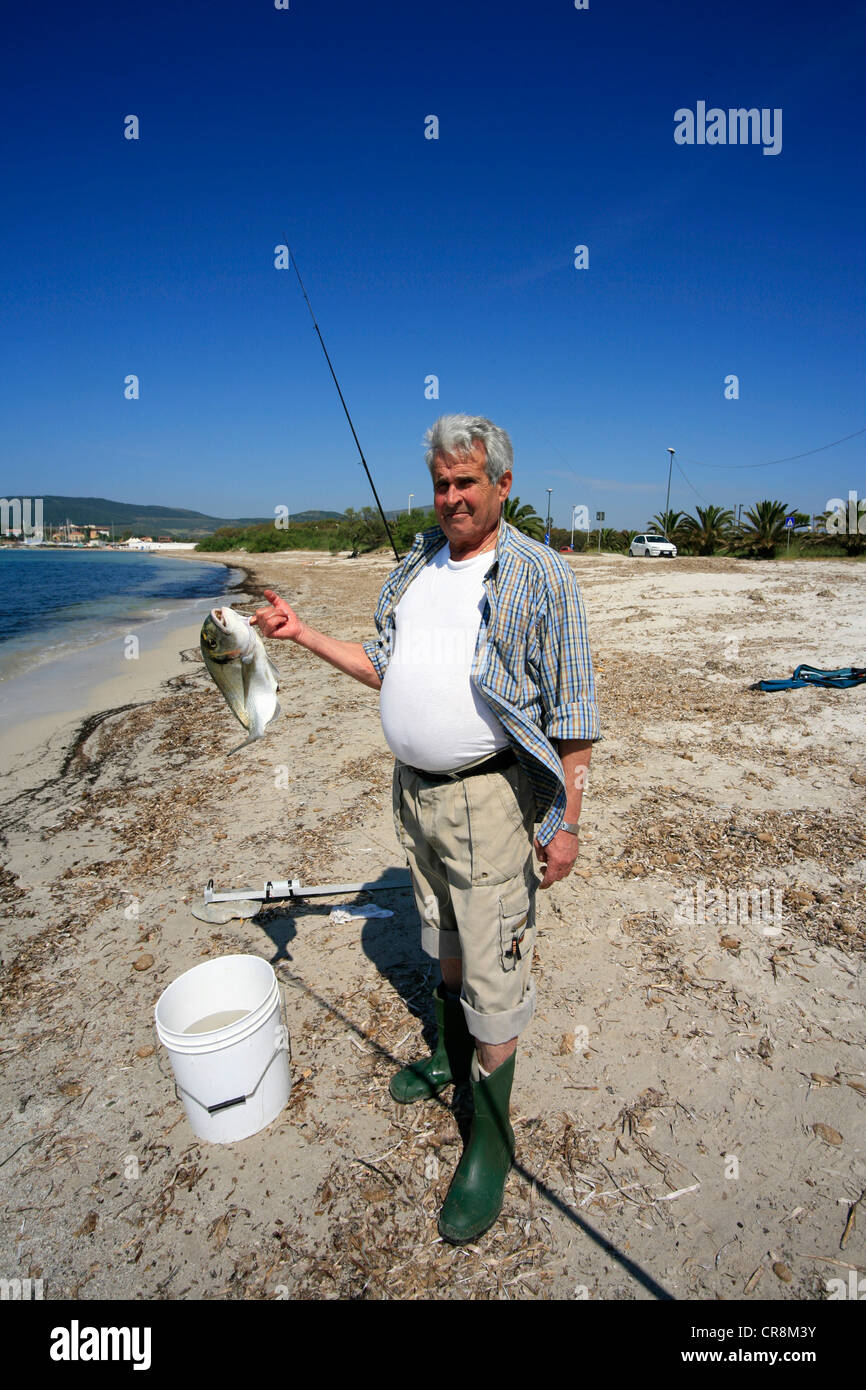 Fisherman catching small fish in hi-res stock photography and images - Alamy