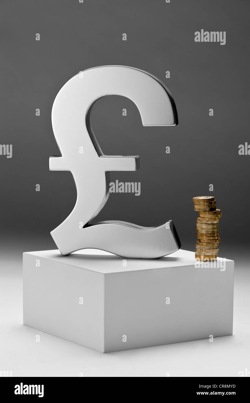 British pound symbol and coins Stock Photo