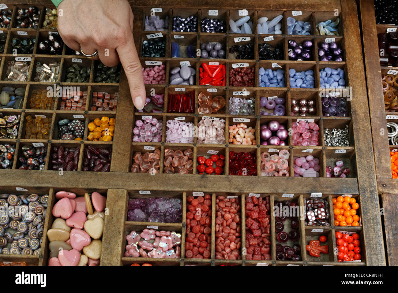 Colorful glass beads for sale in a type case, Flachsmarkt historical crafts market, Krefeld-Linn, North Rhine-Westphalia Stock Photo