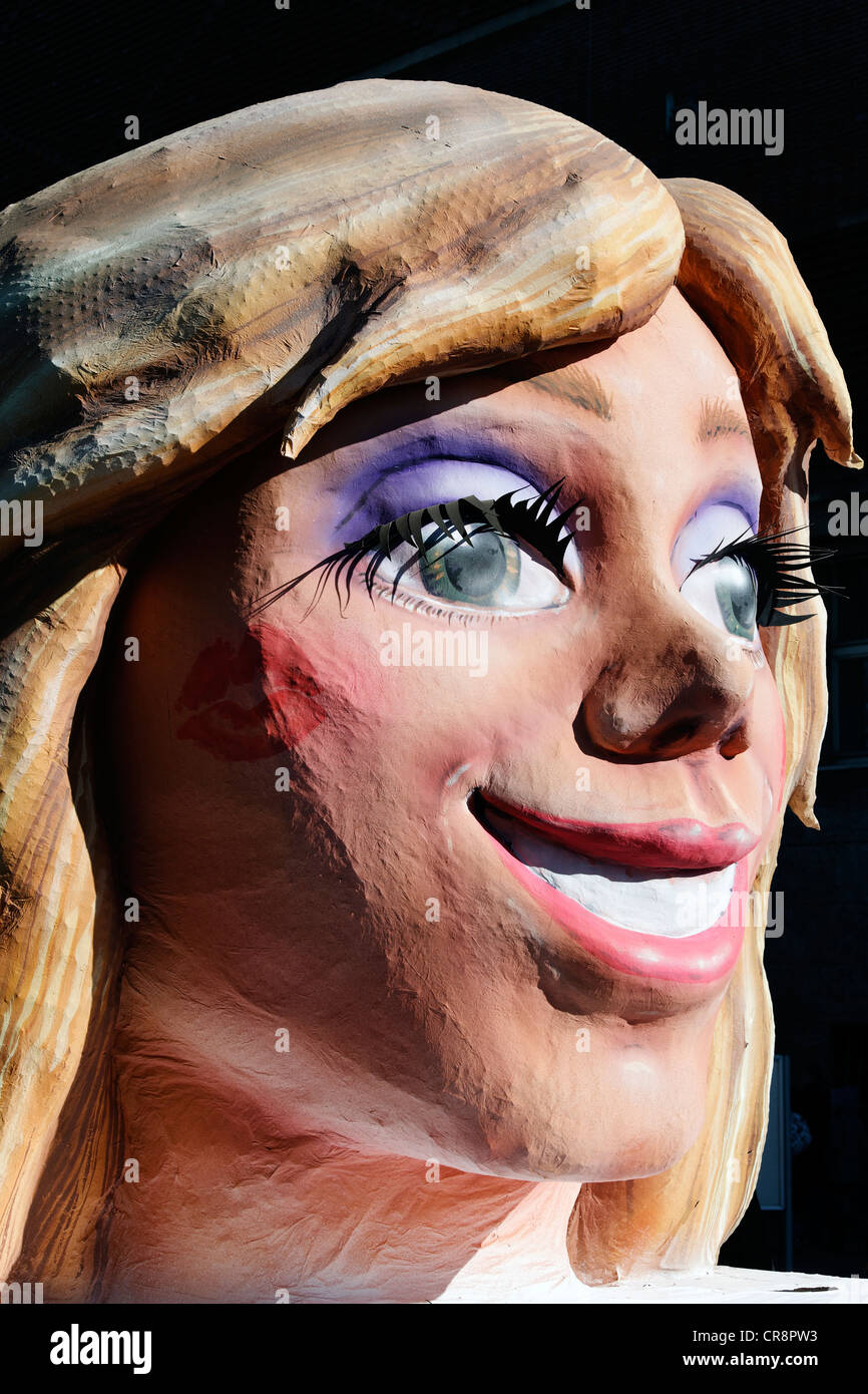 Radiant face of a blond woman, paper-mache figure, parade float at the Rosenmontagszug Carnival Parade 2011, Duesseldorf Stock Photo