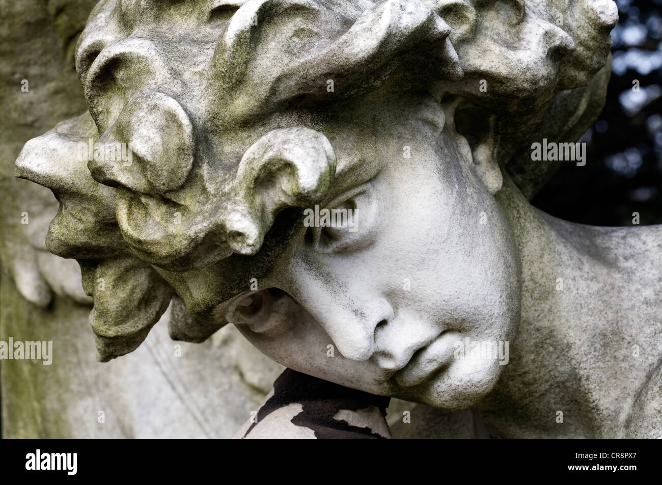 Face of a mourning angel, historic grave sculpture for the painter Andreas Achenbach, Nordfriedhof cemetery, Duesseldorf Stock Photo