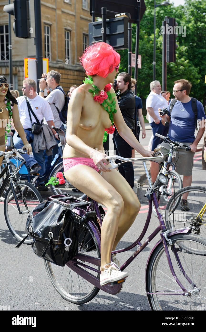 Naked women riding a bike