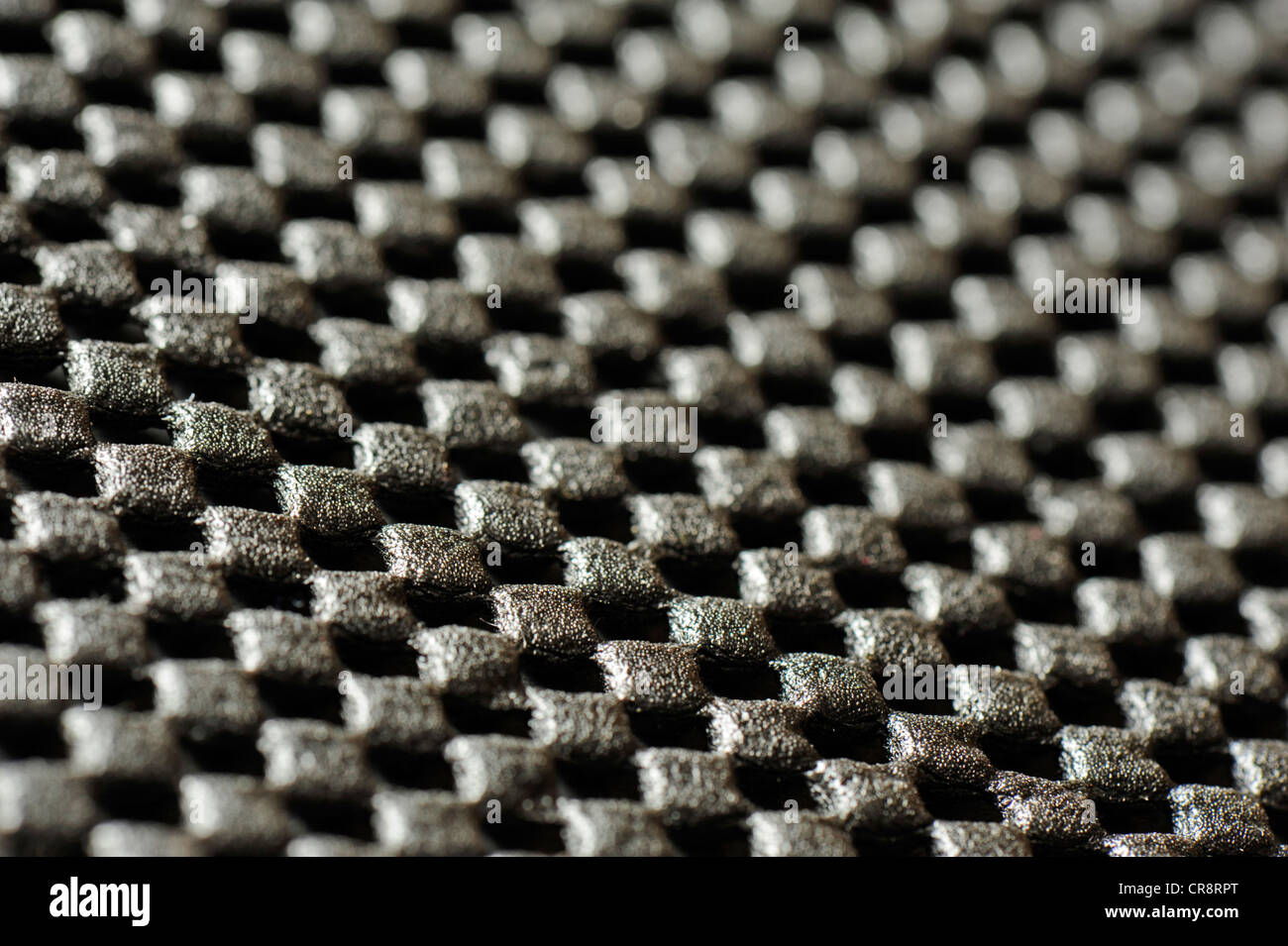 Close-up of black perforated material Stock Photo