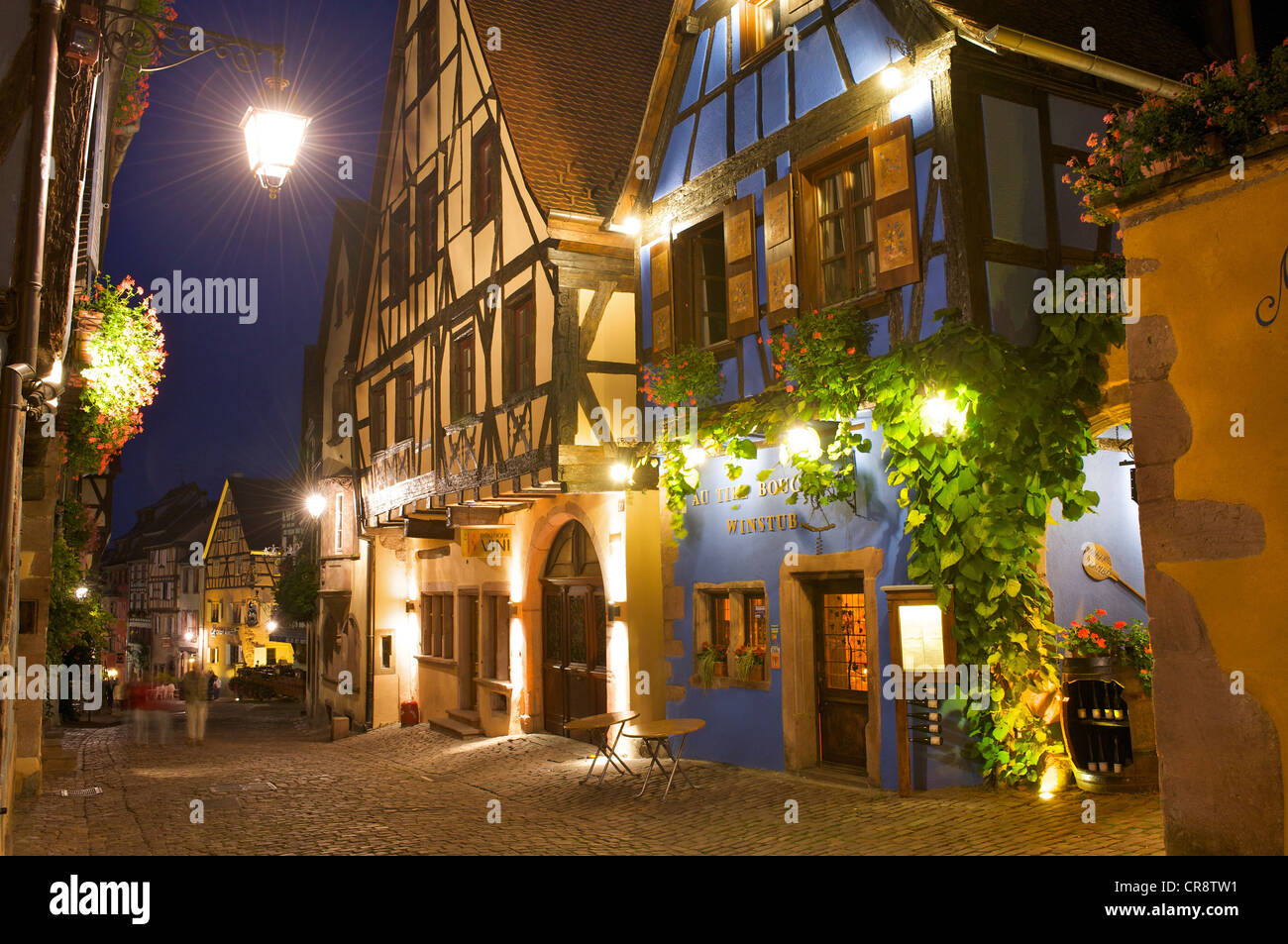 Winery and half-timbered houses at night, Riquewihr, Alsace, France, Europe Stock Photo