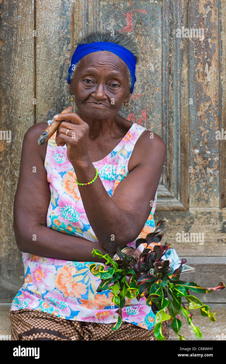 Old woman smoking cigar, Havana, Cuba Stock Photo