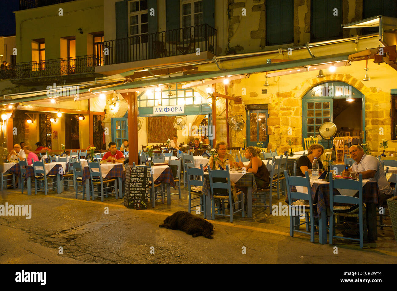 Restaurant at the harbor in Chania, Crete, Greece, Europe Stock Photo