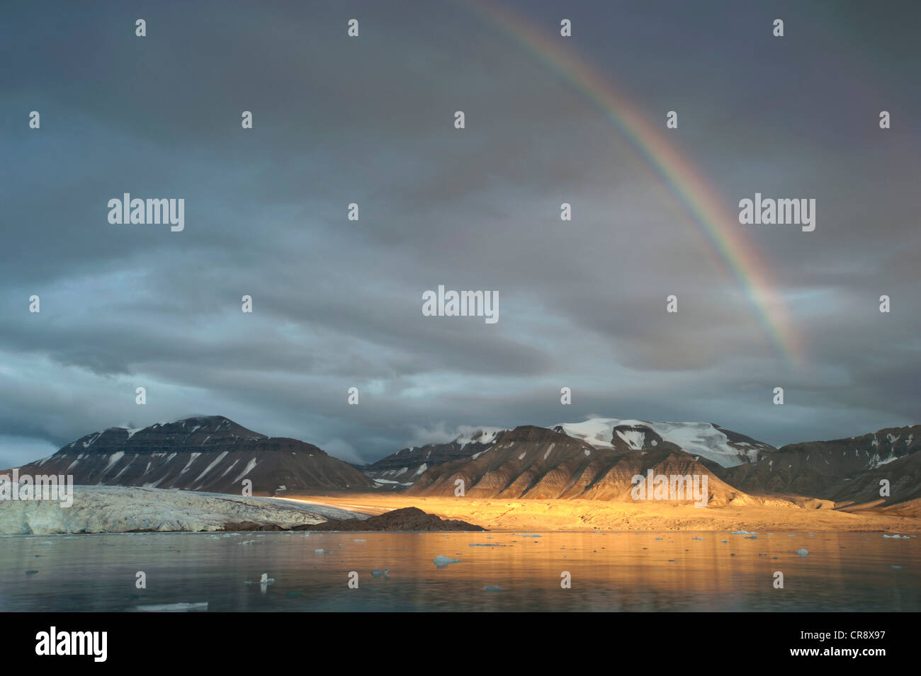 Rainbow over Nordenskioeldbreen Glacier and Adolfbukta bay, Billefjord, Spitsbergen, Svalbard, Norwegen, Skandinavien, Europa Stock Photo