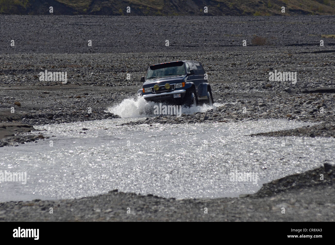 Super jeep driving in the river bed of the Krossá River, Þórsmoerk, Iceland, Europe Stock Photo