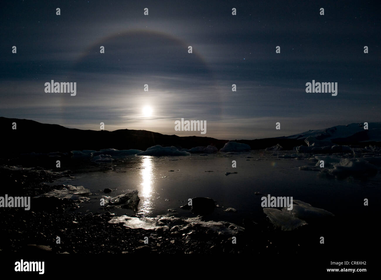 The moon with a 22 ° halo, halo phenomenon, over the Joekulsarlon glacier lagoon, southern Iceland, Europe Stock Photo