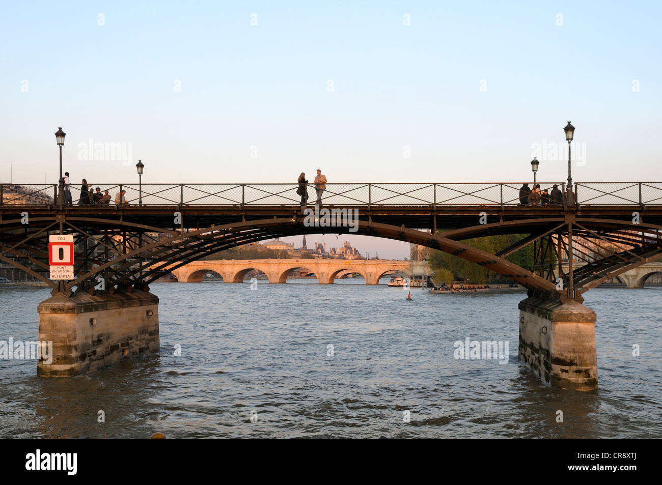 Couple standing on Pont des Arts bridge, Paris, France, Europe Stock ...