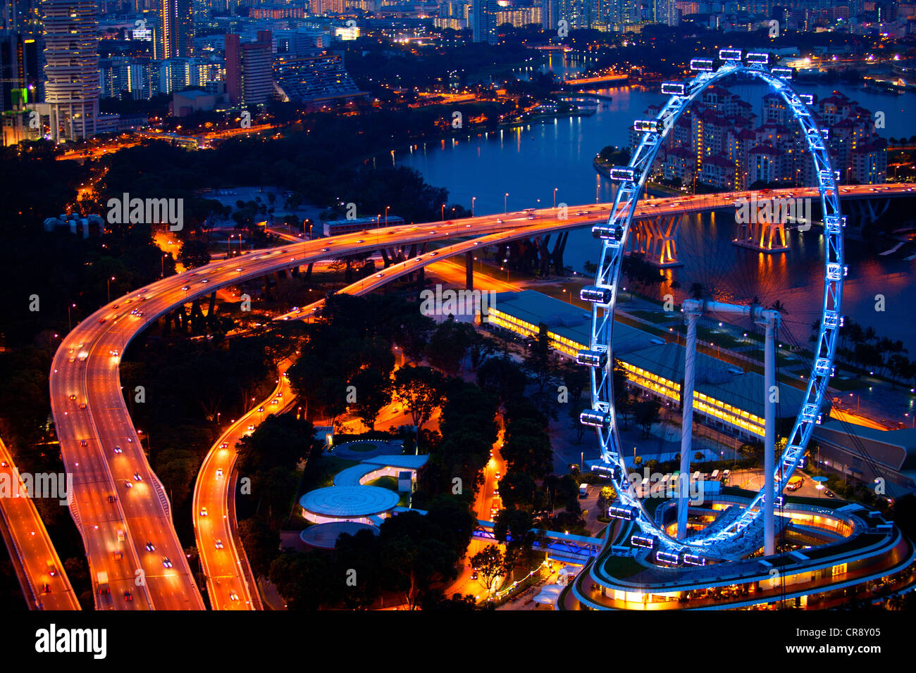 Aerial view on Singapore Flyer from Marina Bay Sands resort at night Stock Photo