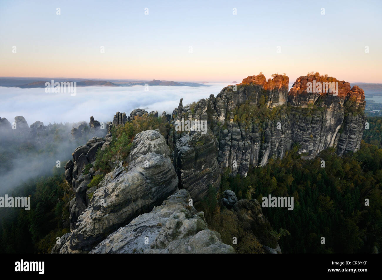 Schrammsteine, a jagged group of rocks, in the fog in the Elbe Sandstone Mountains, Saxon Switzerland, Saxony, Germany, Europe Stock Photo