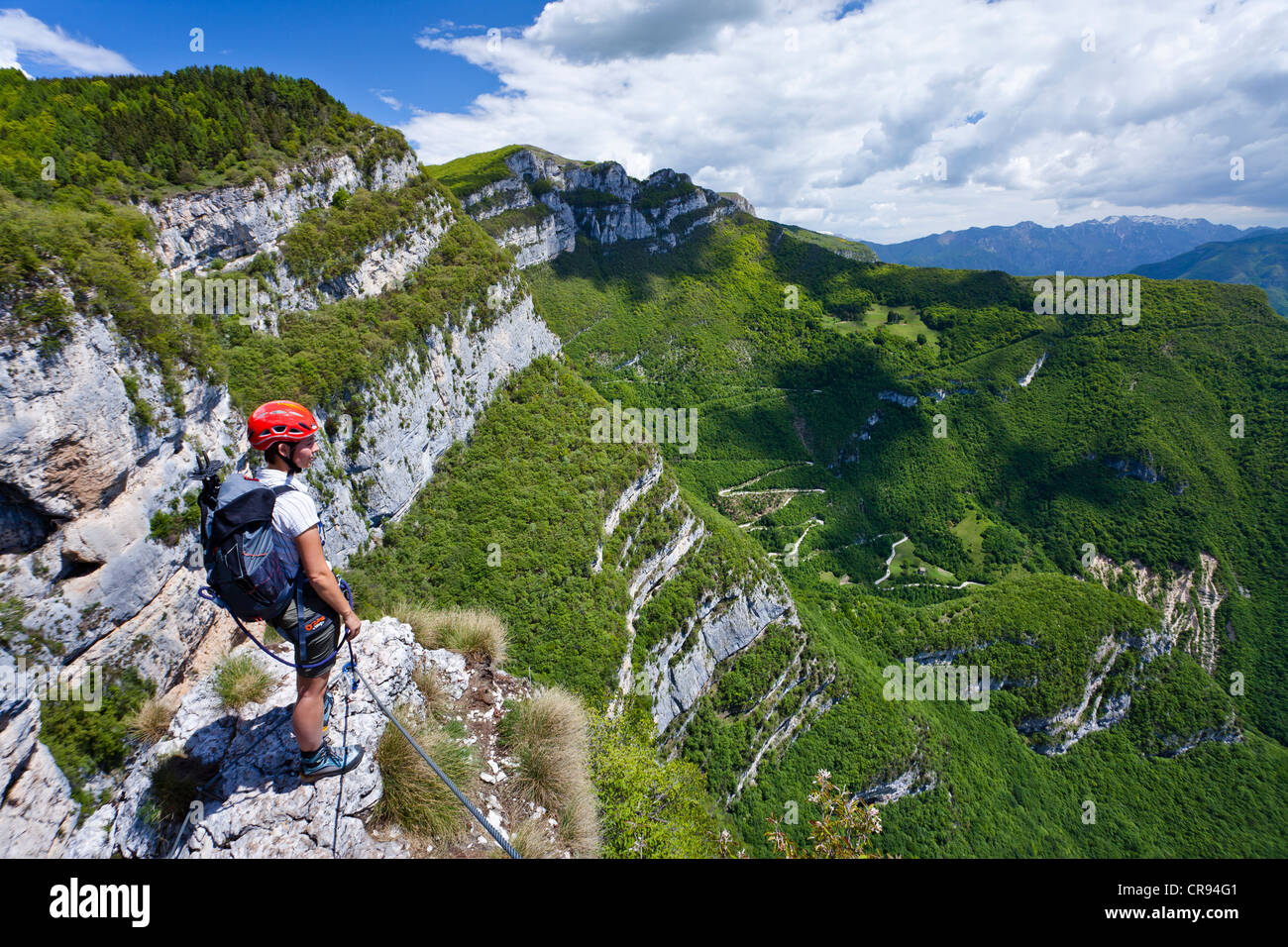 Climbers at the Gerardo Sega fixed rope route on Monte Baldo above Avio, Lake Garda region, Trentino, Italy, Europe Stock Photo