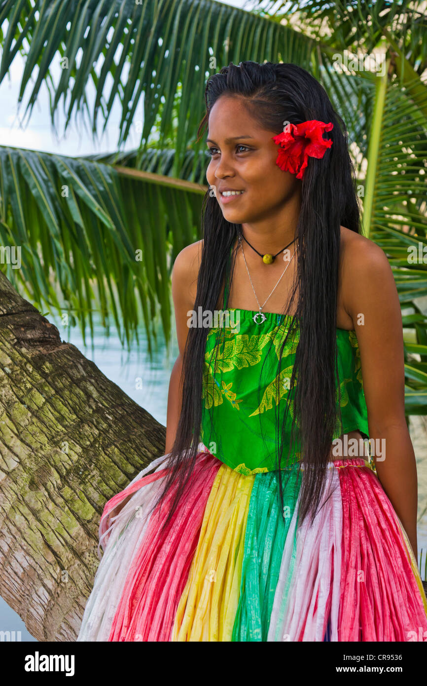 Girl in traditional dress with palm tree, Palau Stock Photo