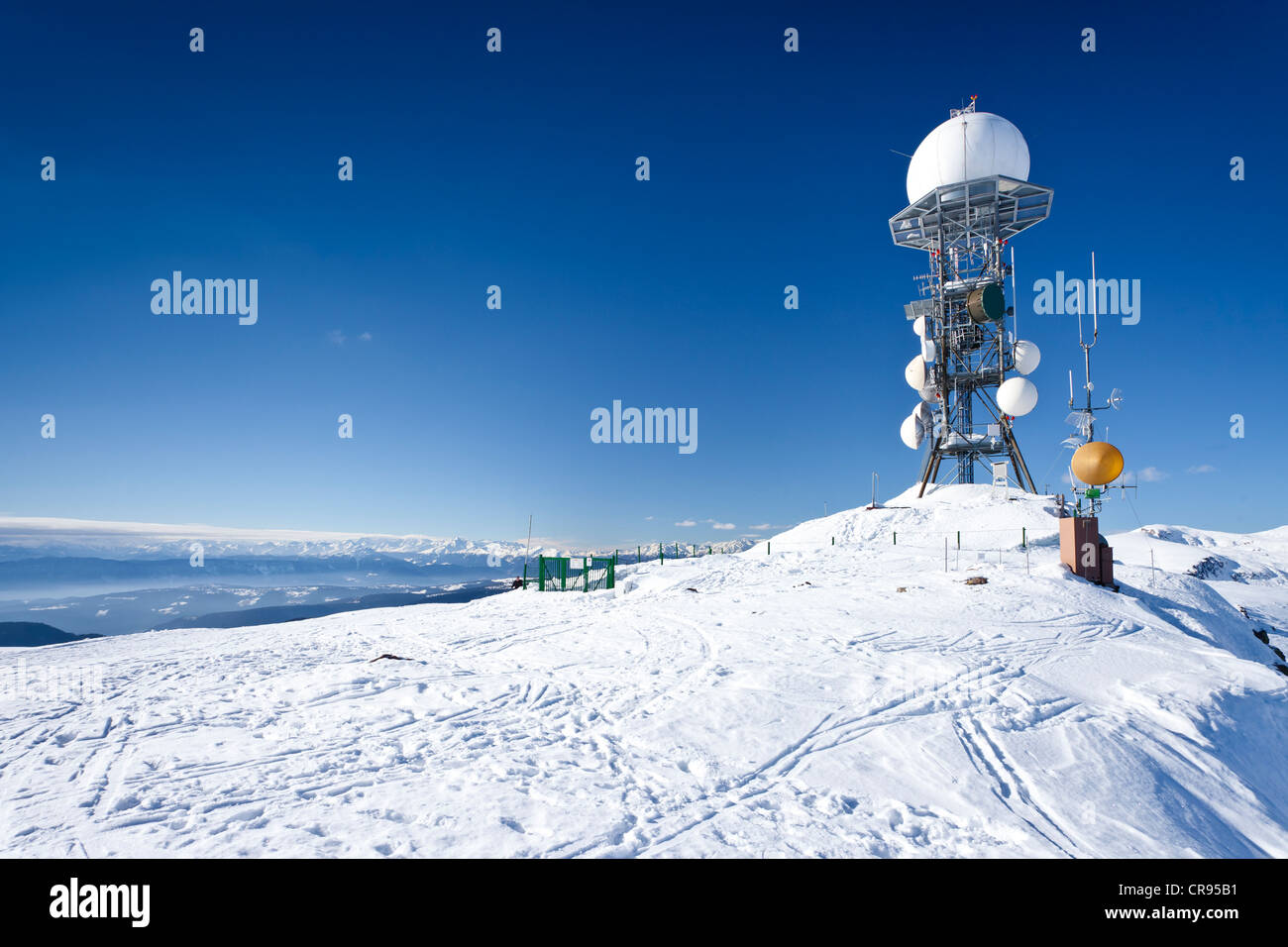 Weather station on Rittnerhorn mountain above Ritten, Renon, Bolzano area, Etschtal valley at the back Stock Photo
