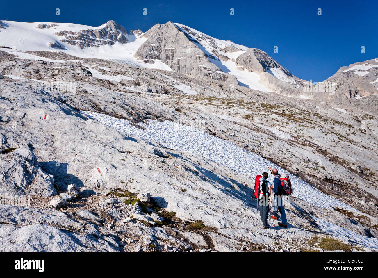 Climbers ascending Mt. Marmolada, Dolomites, Westgrat fixed rope route, Mt. Marmolada in the back, Trentino, Italy, Europe Stock Photo