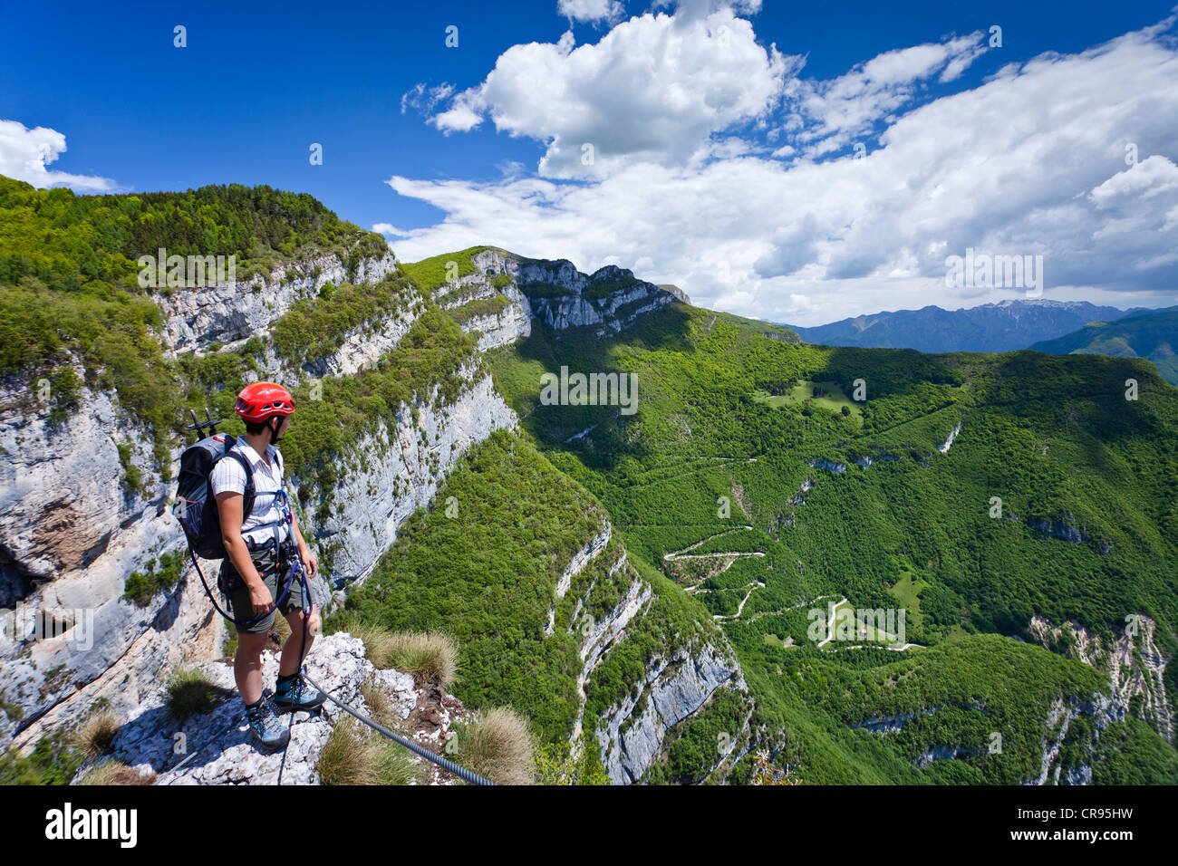 Climber near the Gerardo Sega fixed rope route on Mounte Baldo mountain above Avio, Lake Garda region, province of Trento, Italy Stock Photo