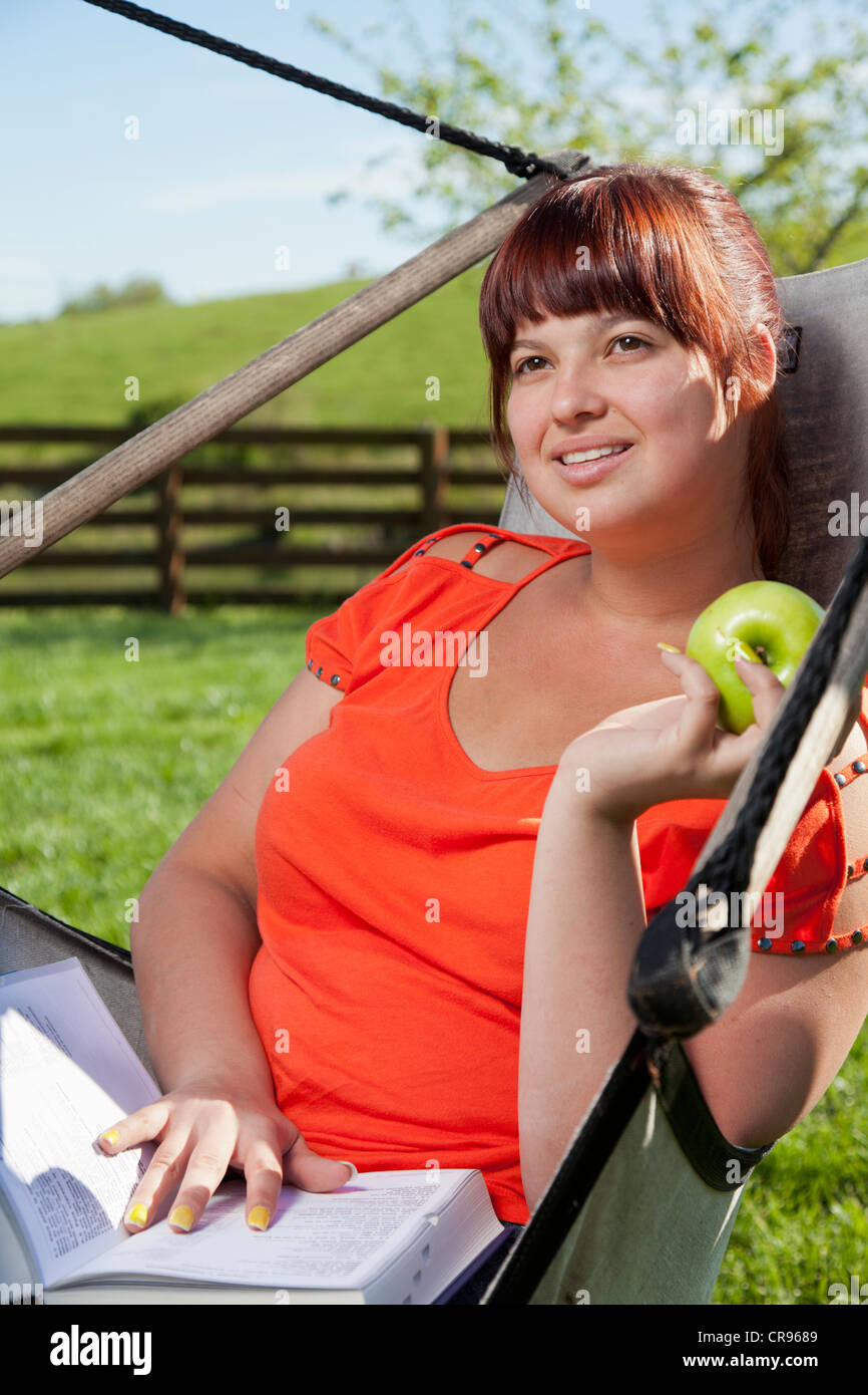 College student studying outdoors Stock Photo