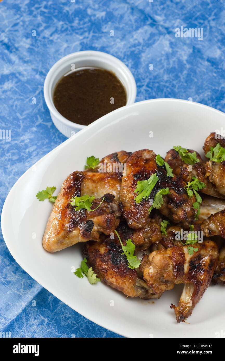 Marinated chicken wings with coriander Stock Photo Alamy