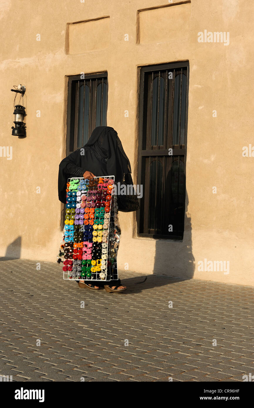 Dubai veiled woman hi-res stock photography and images - Alamy