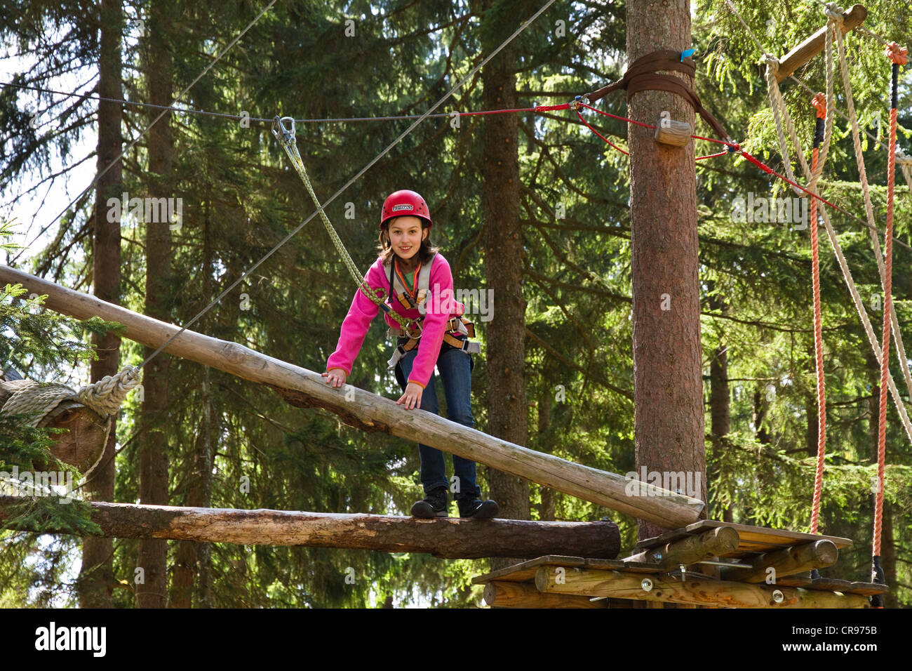 Girl, 11, climbing in a climbing park, Kletterwald, Garmisch