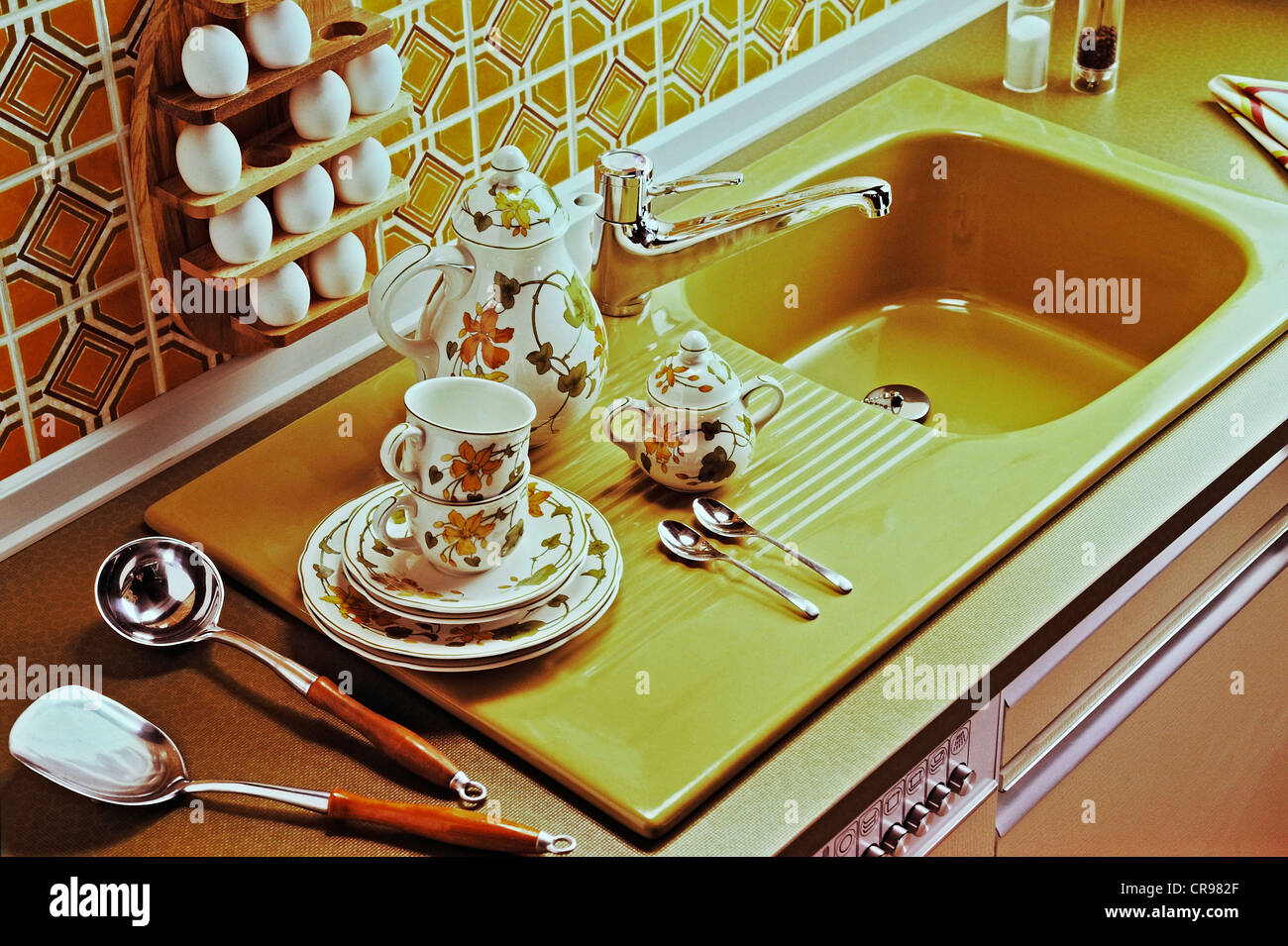 Dishes at a kitchen sink Stock Photo - Alamy