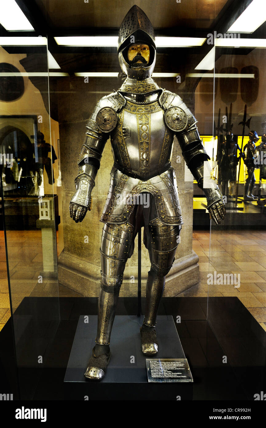 Hall with medieval armour, full ceremonial plate armour of a gentleman from Pienzenau, round 1550, Bavarian National Museum Stock Photo
