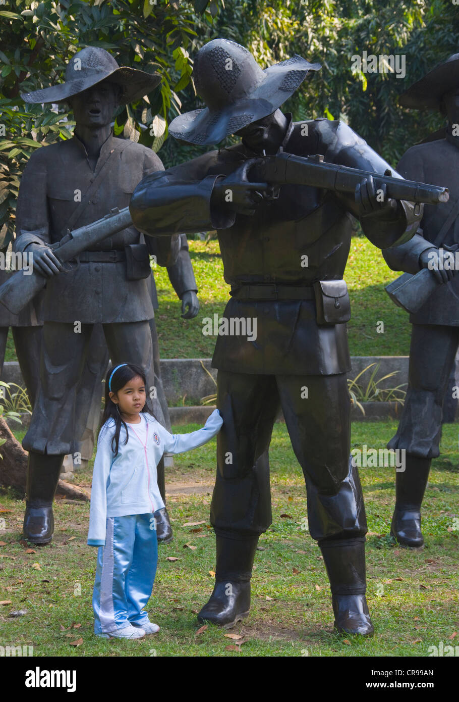 Child with sculptures at Rizal Park, Manila, Philippines Stock Photo