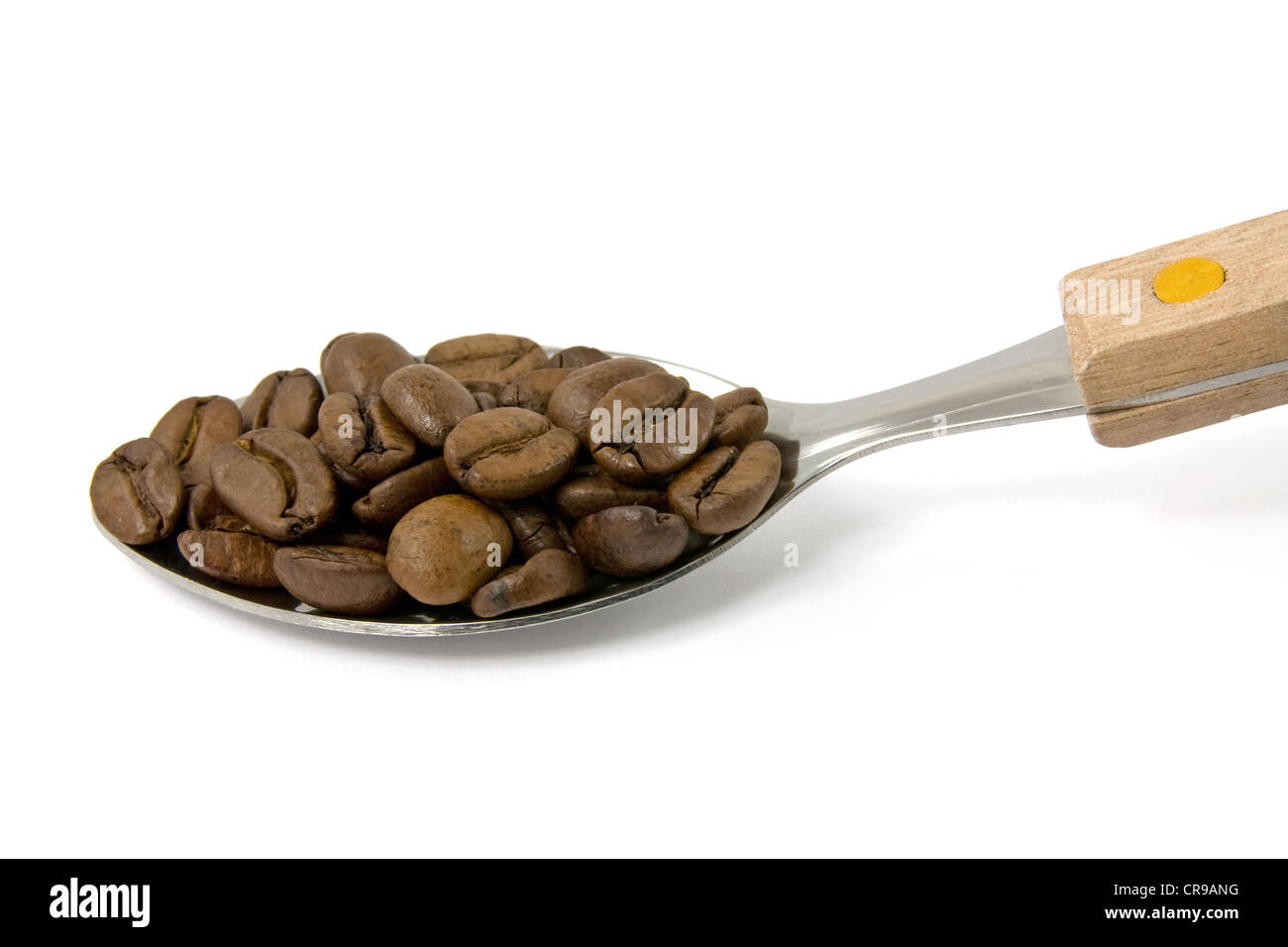 spoon with coffee beans on white background Stock Photo - Alamy