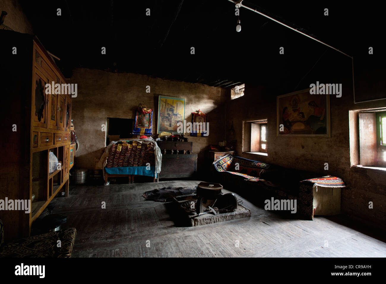 Dong Po Zhang Jia Village. A traditional Tibetan house. Furniture, paintings, decoration, and a large wooden cupboard. Stock Photo