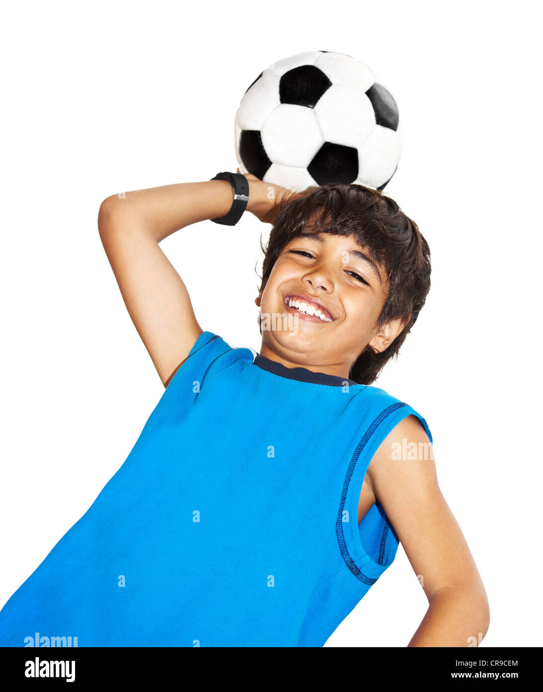 Cute boy playing football, happy child, young male teen goalkeeper