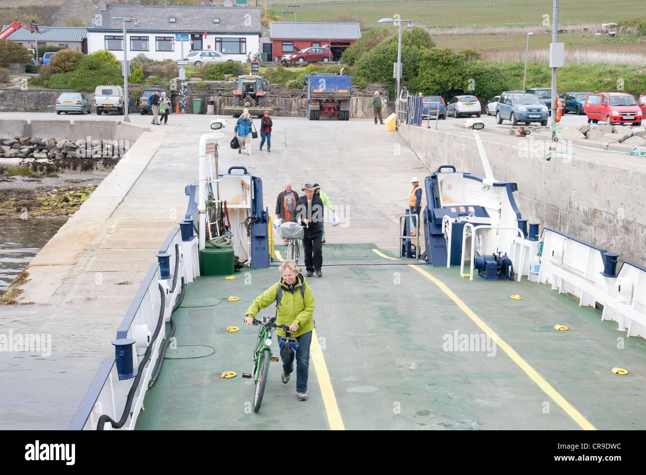 The Island of Rousay cyclists boarding the ferry - Orkney Islands, Scotland Stock Photo