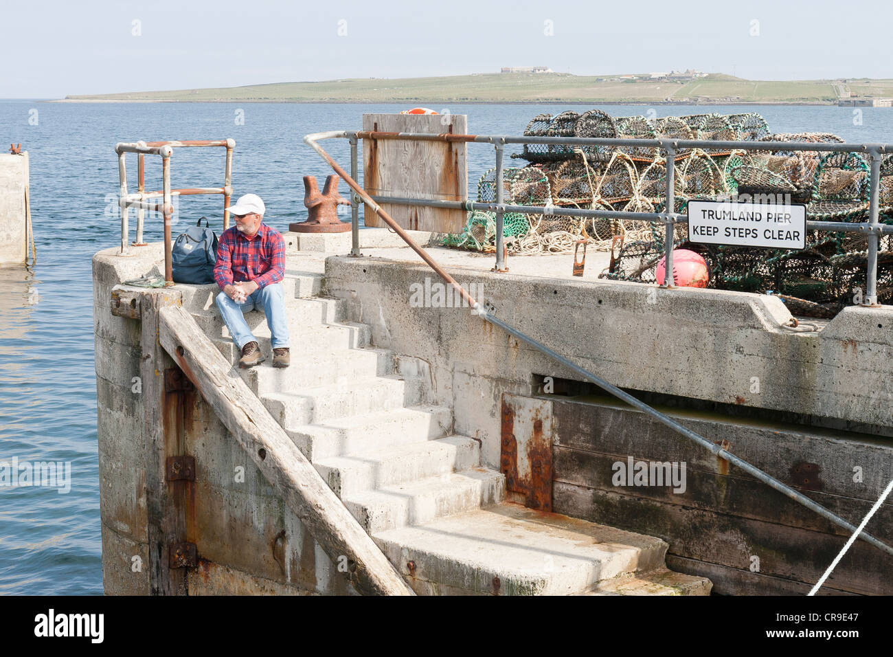 The Island of Rousay - Orkney Islands, Scotland.  A tourist waiting for the ferry Stock Photo
