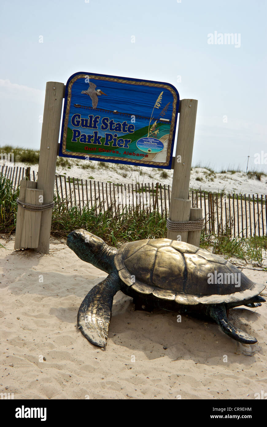 Bronze sea turtle sculpture entrance sign Gulf Shores Alabama State Park saltwater fishing pier Stock Photo