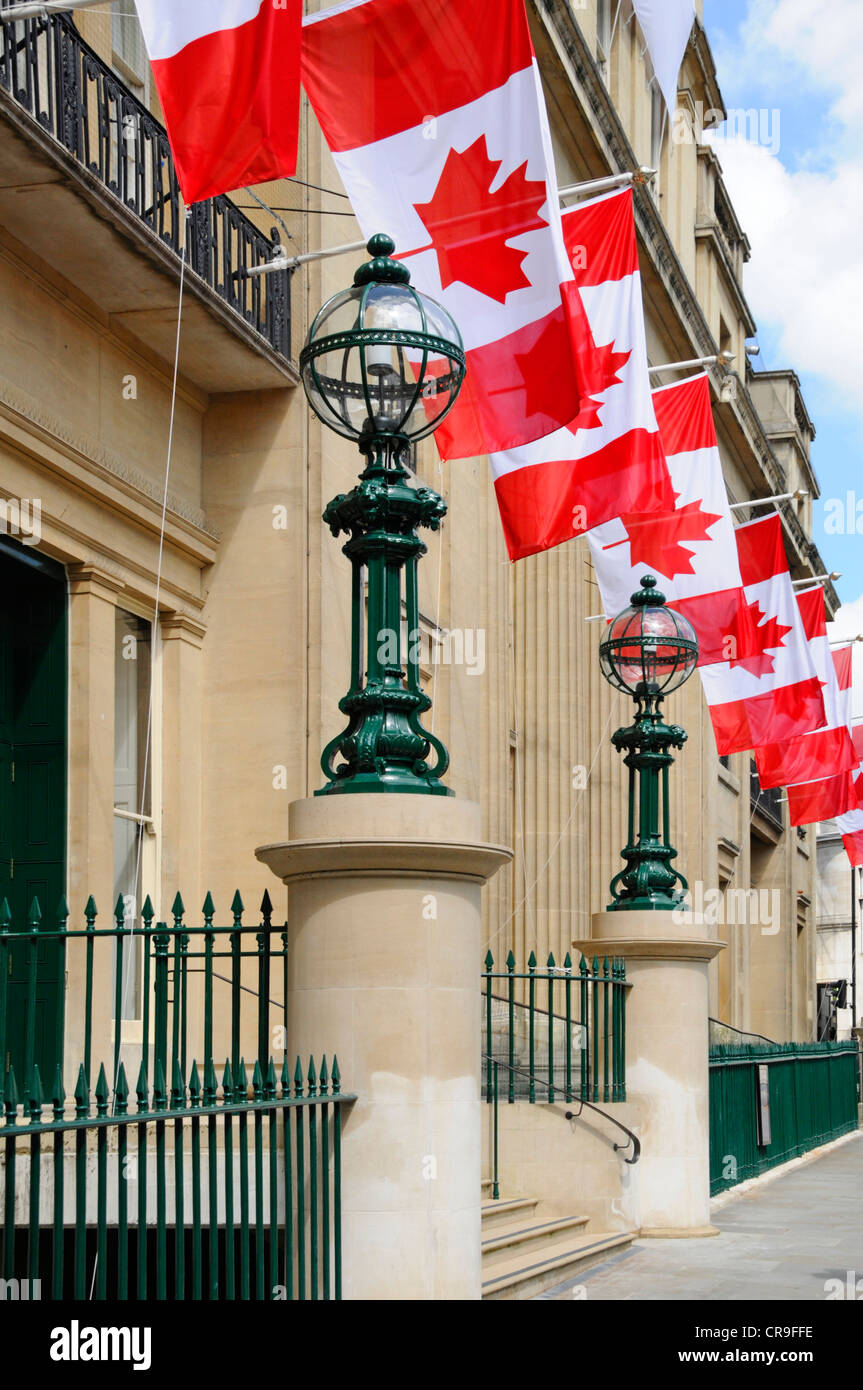Canadian flags outside the High Commission building entrance in Trafalgar Square London England UK Stock Photo