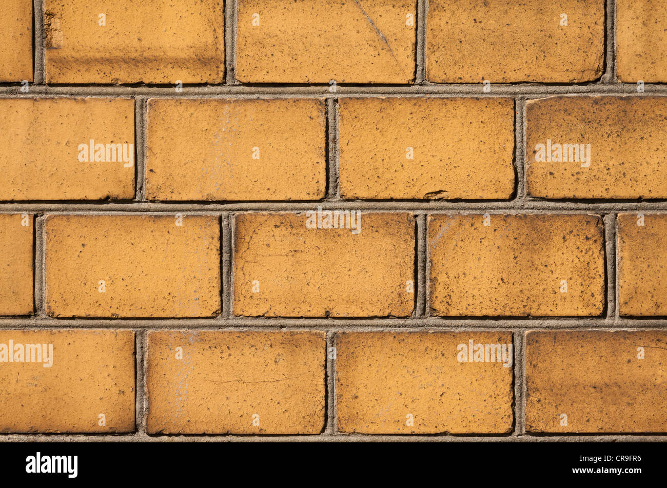 Background with old yellow brick wall Stock Photo