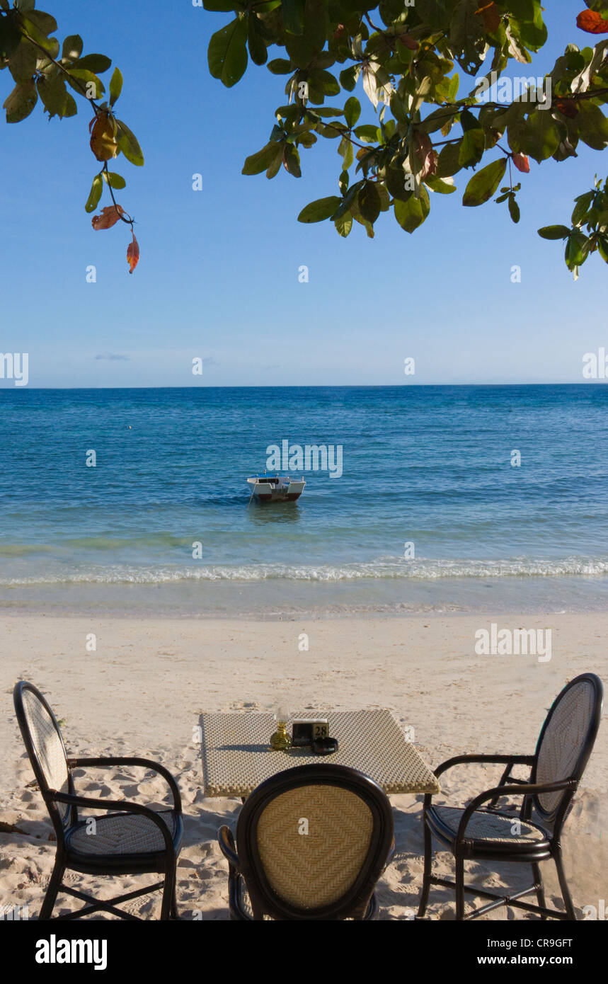 Dining table and chairs by the beach, Bohol Island, Philippines Stock Photo Alamy
