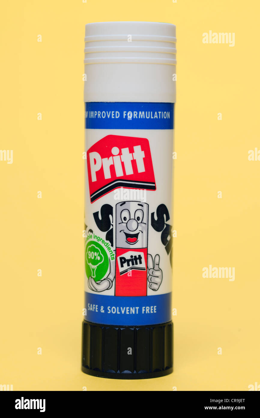 Pritt stick gum glue for paper held in a man's hand Stock Photo - Alamy