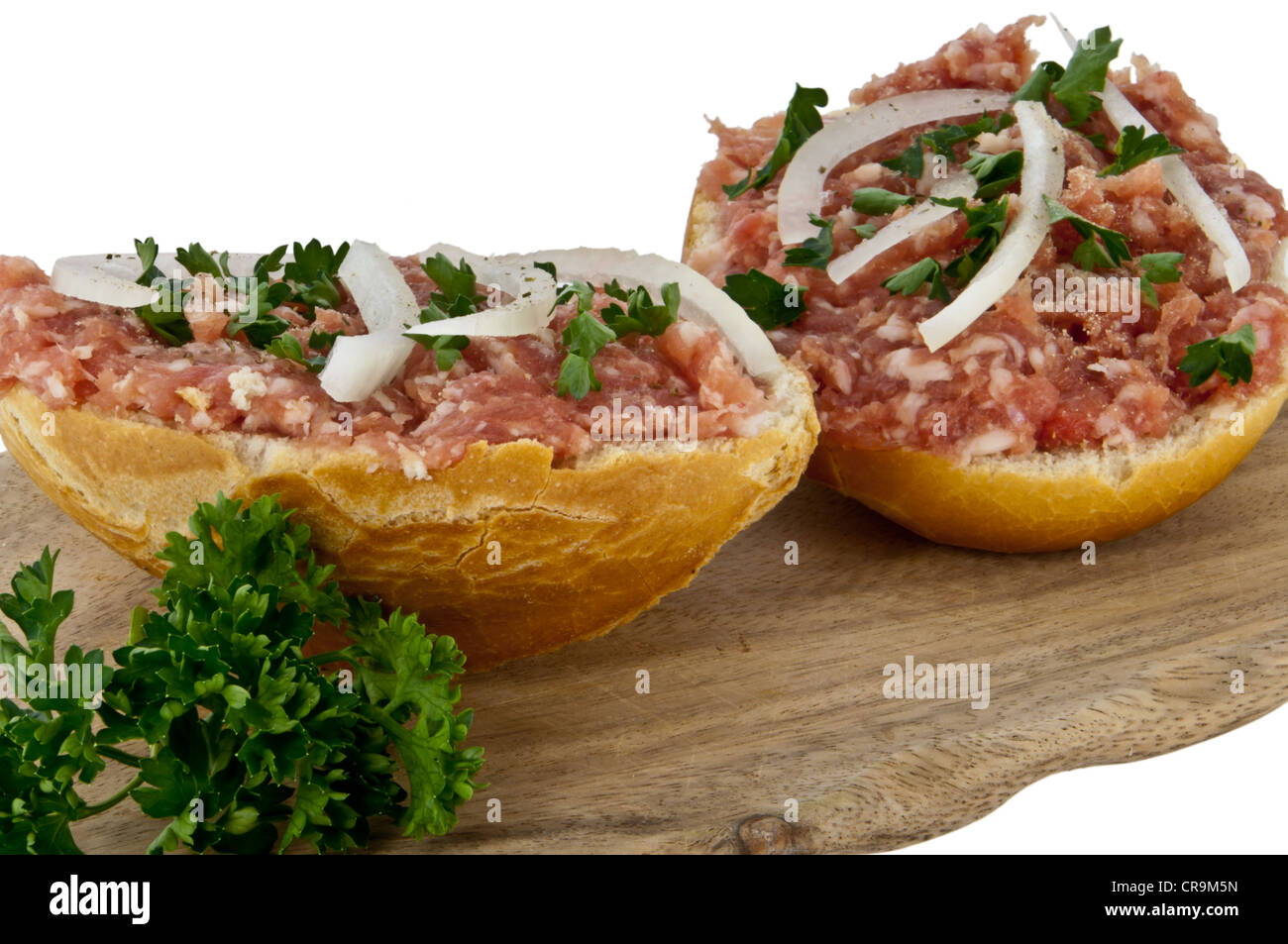 Rolls with minced pork (In German called Mettbrötchen) isolated on white background. Detailed closeup photo Stock Photo