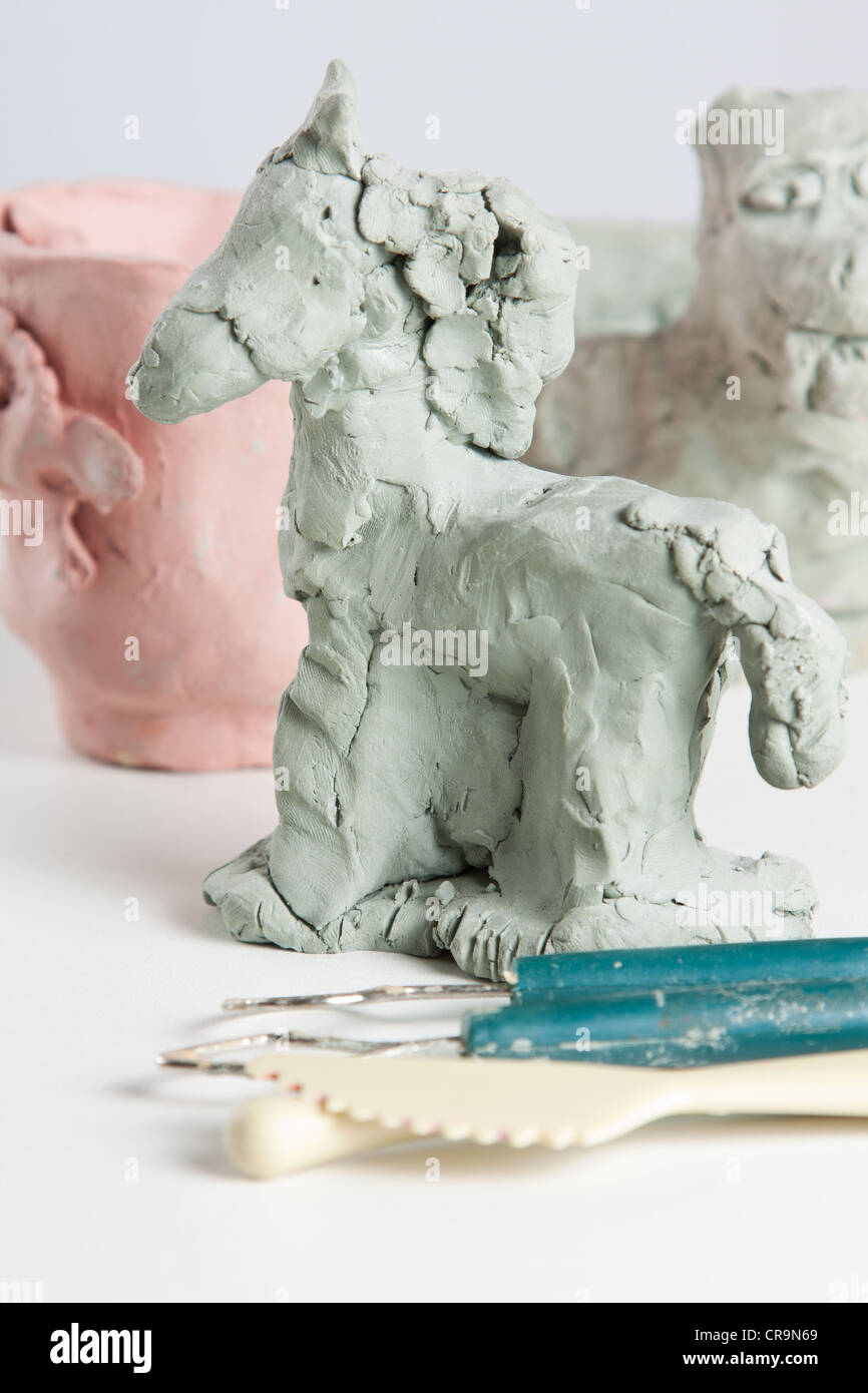 Modelling a clay horse Stock Photo