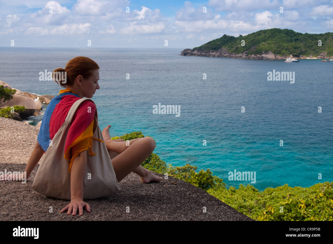 Girl sitting on the rock of Similan island #8 Stock Photo
