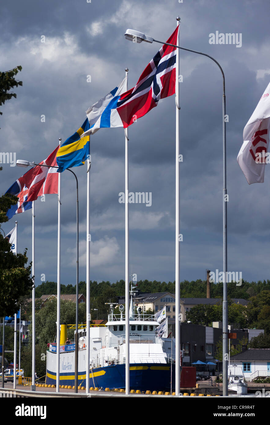 Flags of the nordic countries (from left to right Iceland, Denmark, Sweden, Finland and Norway) fly in the harbour of Oskarshamn Stock Photo