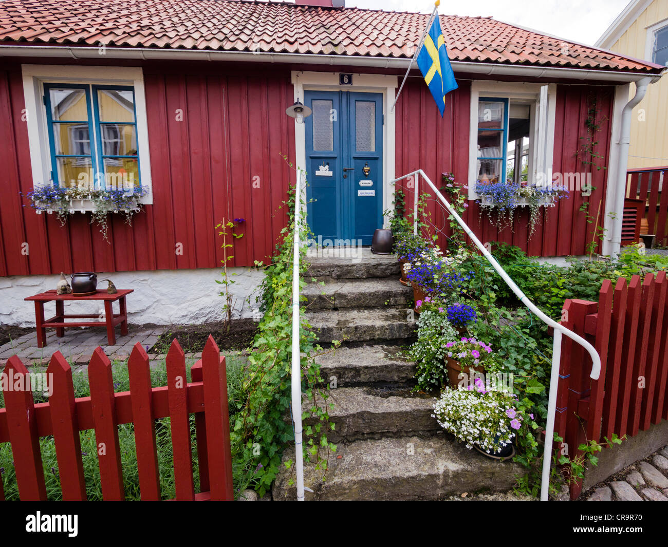 A typical swedish residential house, painted in traditional falun red, at Besvärsgatan in Oskarshamn. Stock Photo