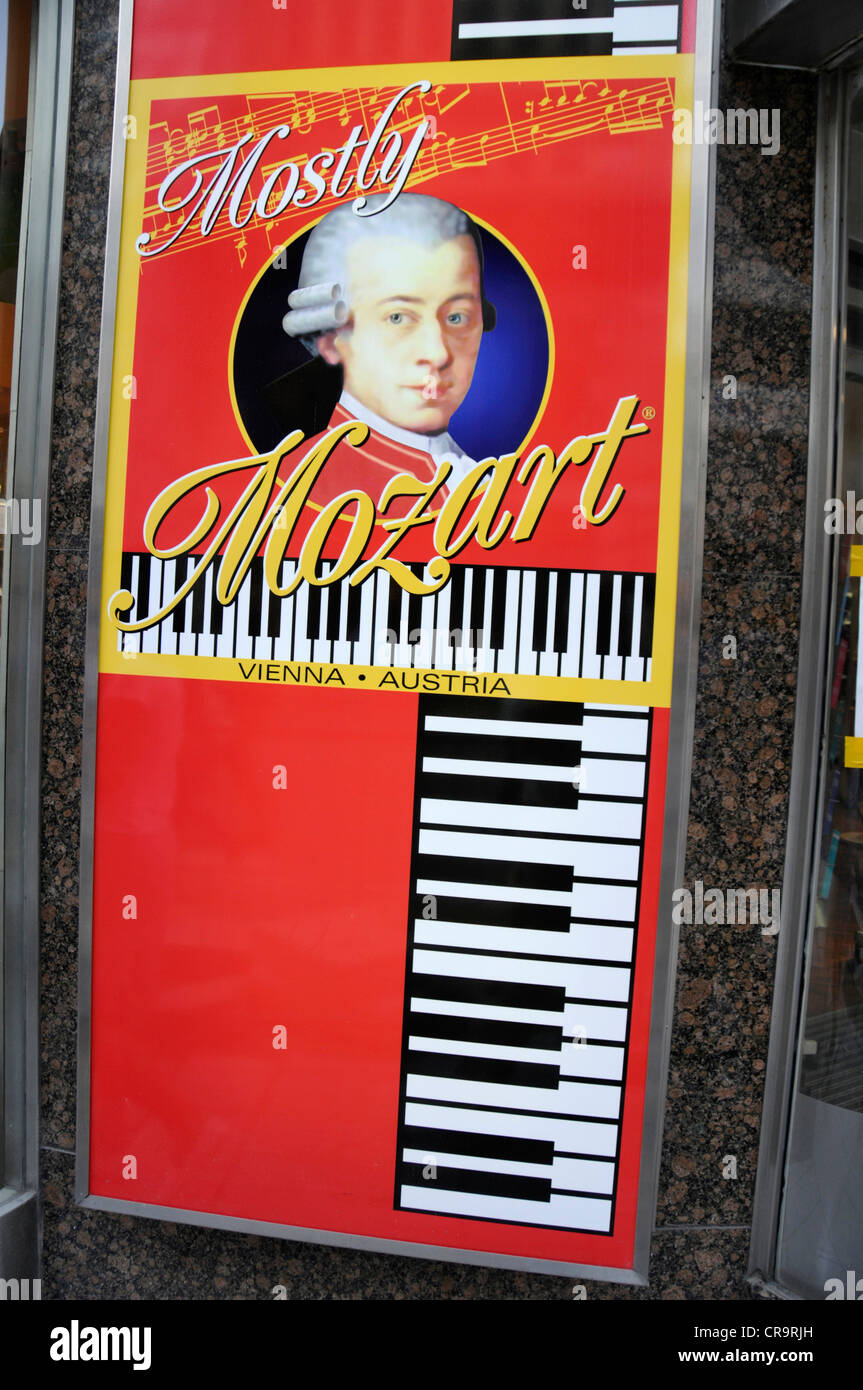 A poster portrait of Mozart and his piano outside a confectionery shop on one of the main streets in Vienna, Austria Stock Photo