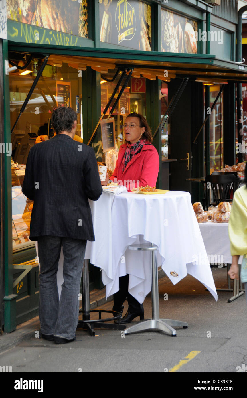 A couple having a morning coffee break at a cafe in the Haschmarkt, in the centre of Vienna, Austria Stock Photo