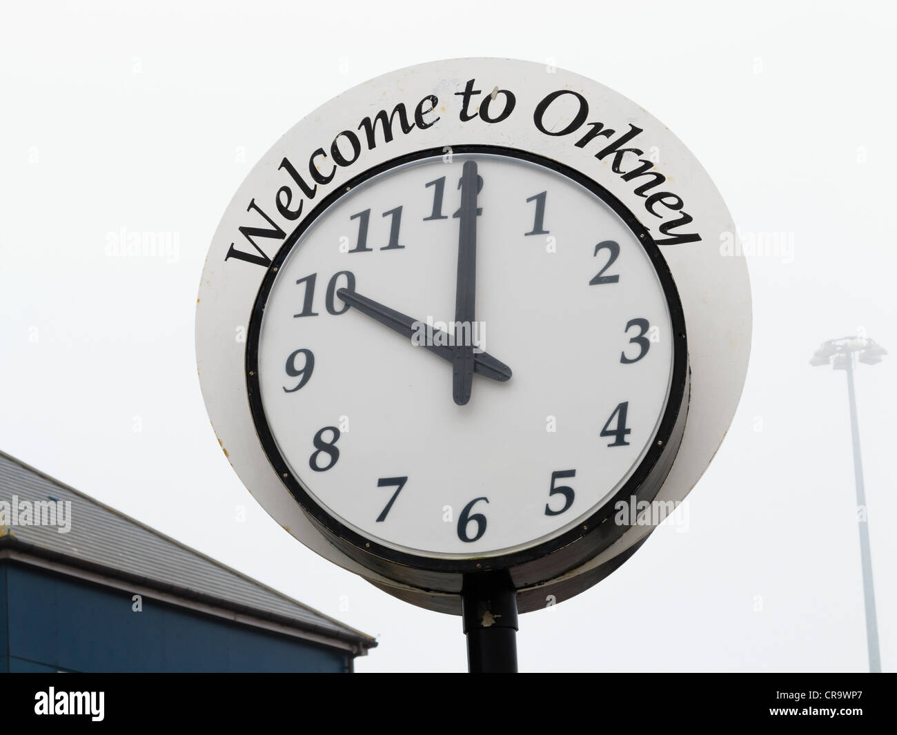 Welcome to Orkney clock in the misty port at Stromness, Orkney Islands, Scotland, UK Stock Photo