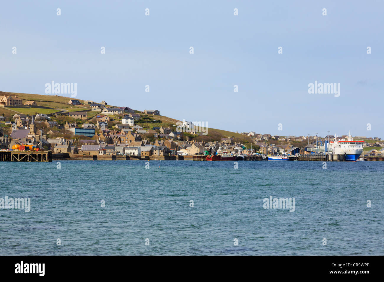 Stromness Orkney Islands Scotland UK. View of town and port from across harbour with Northlink ferry to Scrabster in dock Stock Photo