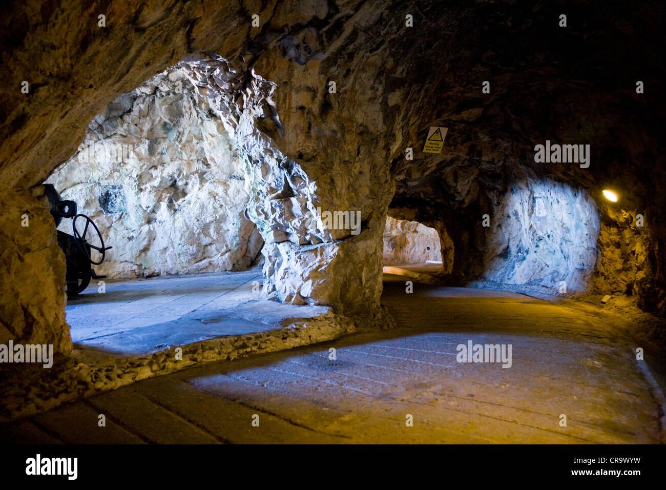 Two embrasures (apertures / windows / cannon / gun ports) inside The Great Siege tunnels / tunnel in / on The Rock of Gibraltar Stock Photo