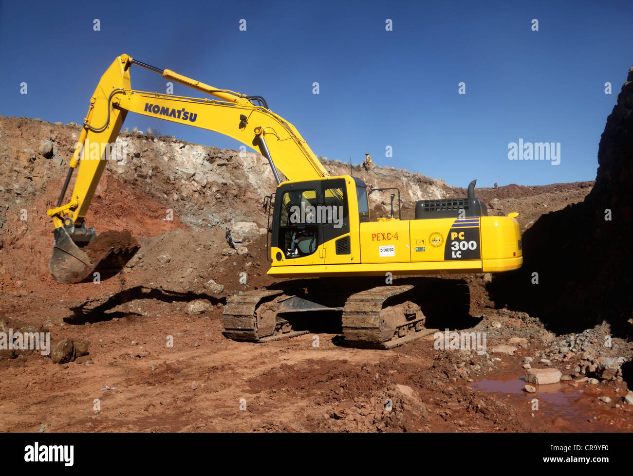 A Komatsu PC 300LC excavator being used on a road construction project in the highlands of Potosi Department, Bolivia Stock Photo